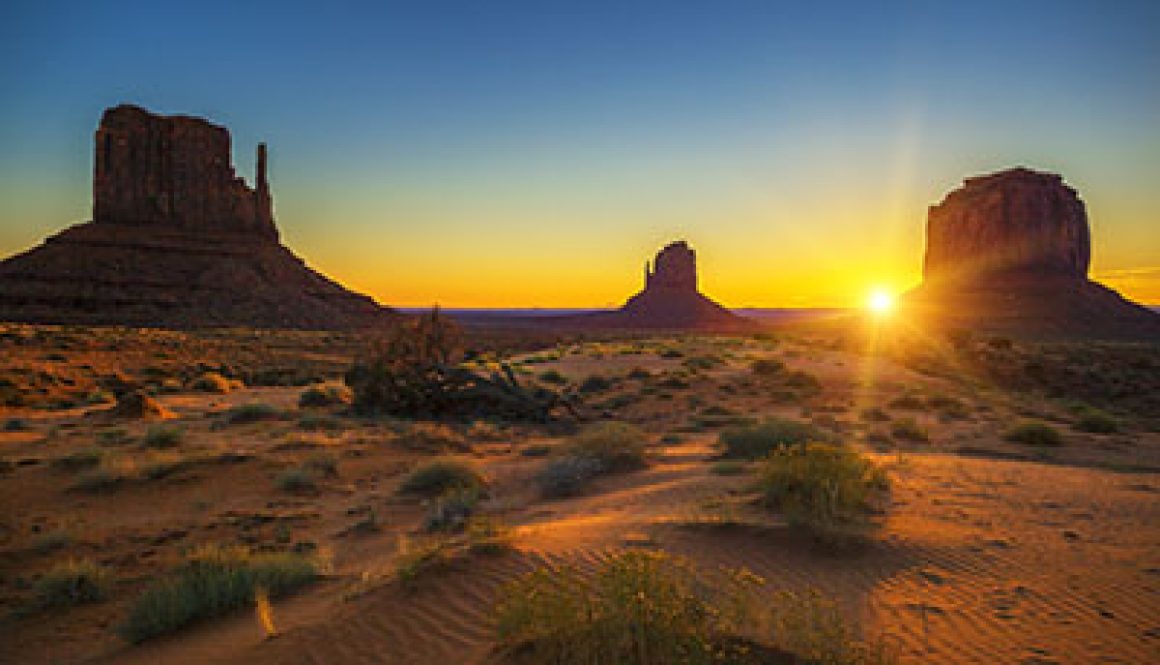 Horizontal view of sunrise at Monument Valley